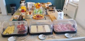 a table with several trays of food on it at Quinta Nova Vale Del Rey in Carvoeiro