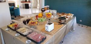 a table with a buffet of food on it at Quinta Nova Vale Del Rey in Carvoeiro