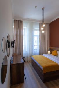 Postel nebo postele na pokoji v ubytování Hotel Avenue 106