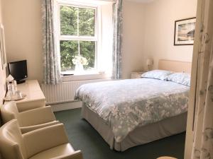 Ένα ή περισσότερα κρεβάτια σε δωμάτιο στο Elerkey Guest House