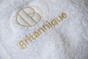 a white towel with a happy anniversary written on it at Hotel Britannique in Maastricht