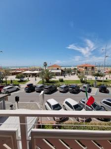 a view of a parking lot with cars parked at Hotel Milani in Lido di Camaiore