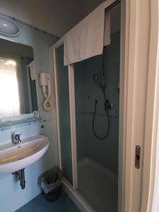 a bathroom with a shower and a sink at Hotel Milani in Lido di Camaiore +34 photos