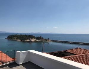 a view of the ocean from the balcony of a house at Casa Laryssiou in Gythio