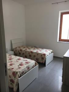 Postel nebo postele na pokoji v ubytování Casa Talamo/ Appartamento Mara
