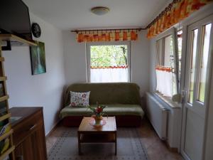 a living room with a couch and a table at Apartma Rutar in Tolmin