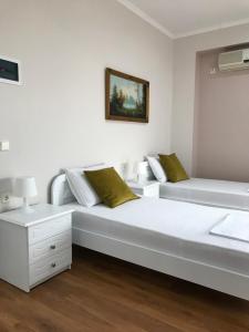 Postel nebo postele na pokoji v ubytování Joy Hotel