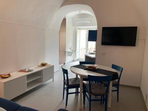 A television and/or entertainment centre at Amalfi Sea view First floor “Casa Mia “