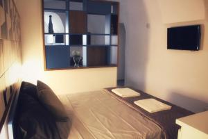 A television and/or entertainment centre at Amalfi Sea view First floor “Casa Mia “