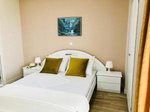 Postel nebo postele na pokoji v ubytování Joy Hotel