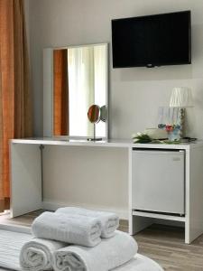 TV a/nebo společenská místnost v ubytování Joy Hotel