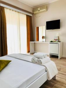 Postel nebo postele na pokoji v ubytování Joy Hotel