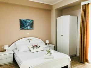 Postel nebo postele na pokoji v ubytování Joy Hotel