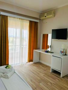 TV a/nebo společenská místnost v ubytování Joy Hotel
