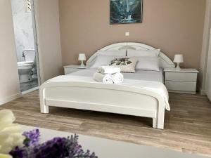Postel nebo postele na pokoji v ubytování Joy Hotel