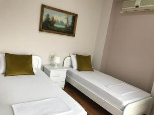 Postel nebo postele na pokoji v ubytování Joy Hotel