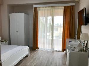 Postel nebo postele na pokoji v ubytování Joy Hotel