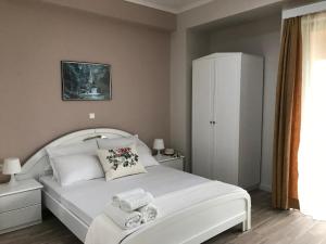 Postel nebo postele na pokoji v ubytování Joy Hotel