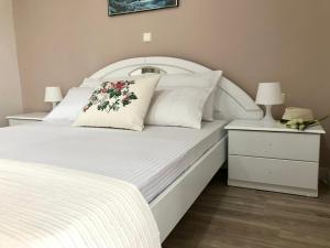 Postel nebo postele na pokoji v ubytování Joy Hotel