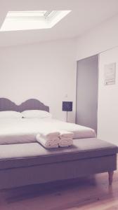 Una cama o camas en una habitación de Évora Art&Accommodation