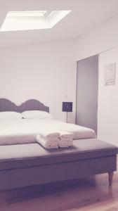 Postel nebo postele na pokoji v ubytování Évora Art&Accommodation