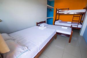 En eller flere senge i et værelse på Hostal Alcazaba