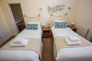 Cama ou camas em um quarto em The Red Lion Hotel