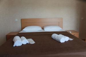 Ένα ή περισσότερα κρεβάτια σε δωμάτιο στο Guest House Maradona