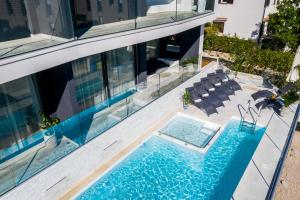 an aerial view of a house with a swimming pool at Villa Valis in Baška