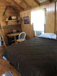 מיטה או מיטות בחדר ב-Ft. Wilderness RV Park and Campground