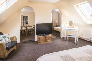 Postel nebo postele na pokoji v ubytování Karle Hotel