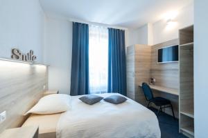 Postel nebo postele na pokoji v ubytování Hotel Acacia