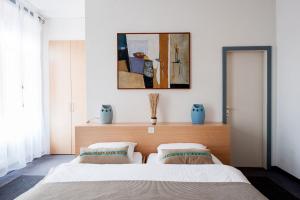 Postel nebo postele na pokoji v ubytování Hotel Acacia