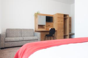 TV a/nebo společenská místnost v ubytování Hotel Acacia