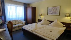 Postel nebo postele na pokoji v ubytování Central Hotel