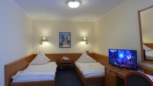 Postel nebo postele na pokoji v ubytování Central Hotel