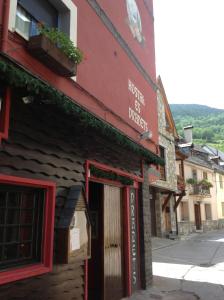 a building with a sign on the side of it at Pradets in Vielha