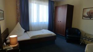 Postel nebo postele na pokoji v ubytování Central Hotel