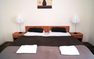 Postel nebo postele na pokoji v ubytování Hotel STARÝ PIVOVAR