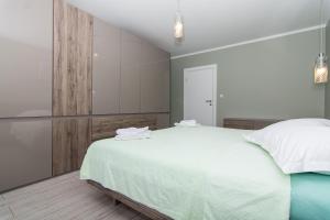 Posteľ alebo postele v izbe v ubytovaní apartman Marin