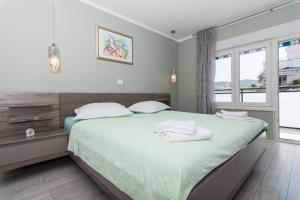 Posteľ alebo postele v izbe v ubytovaní apartman Marin
