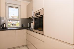 Kuchyňa alebo kuchynka v ubytovaní apartman Marin