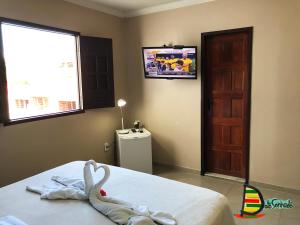 TV a/nebo společenská místnost v ubytování Pousada Velosmar