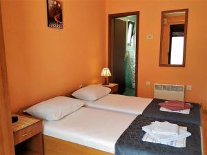 Postel nebo postele na pokoji v ubytování Villa Budvanka Guesthouse