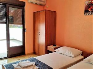 Postel nebo postele na pokoji v ubytování Villa Budvanka Guesthouse