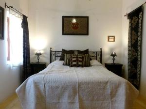 Postel nebo postele na pokoji v ubytování Hamari Haveli