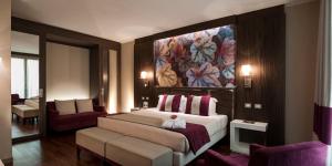 Кровать или кровати в номере Ramada Plaza Milano