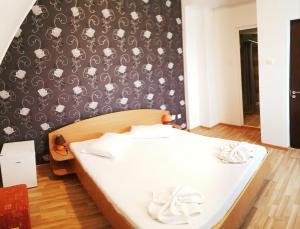 Postel nebo postele na pokoji v ubytování Casa CIC