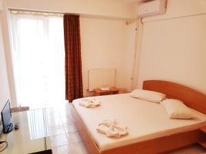 Postel nebo postele na pokoji v ubytování Casa CIC