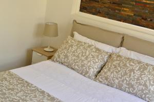 A bed or beds in a room at Modarno Exclusive Apartments